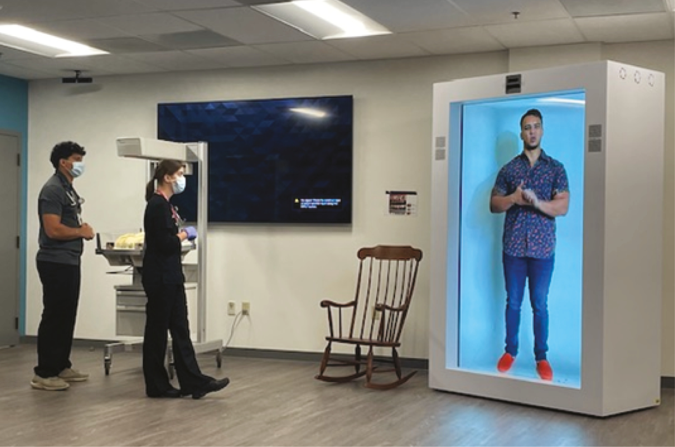 Participants interacting with the hologram.